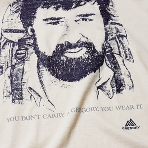 GREGORY "YOU DON'T CARRY A GREGORY, YOU WEAR IT." WAYNE GREGORY PORTRAIT T-SHIRT (CREAM)